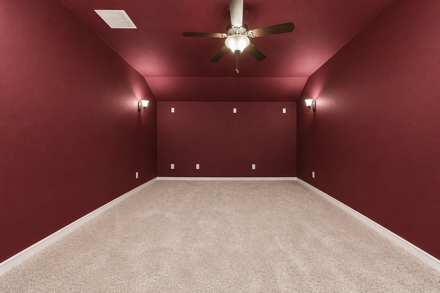 1008 Point Isabel Lane Friendswood, TX 77546 - Photo 38 of 50 A true media room features rich accent walls, plush carpet, and dimmable wall sconces for a theater like setting. The enclosed design provides an ideal space for movies, gaming, or quiet viewing away from the main areas of the home.