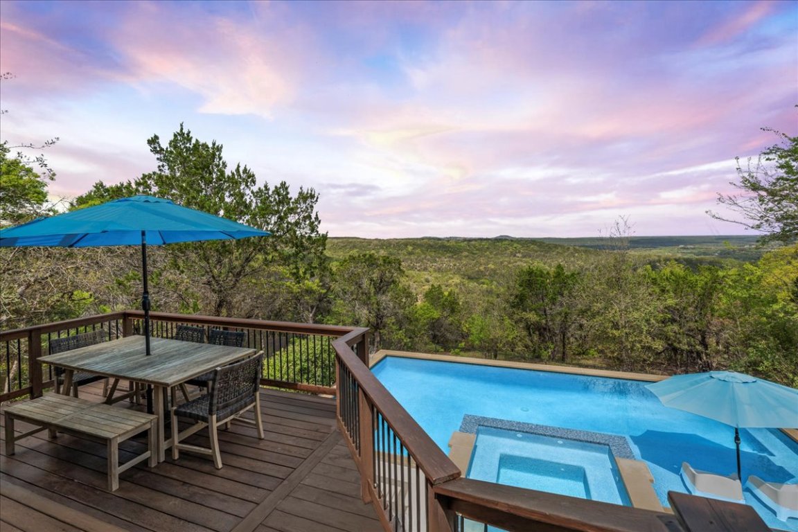 12221 Lake Stone Drive Austin, TX 78738 - Photo 1 of 1 a view of a chairs and table on the wooden floor