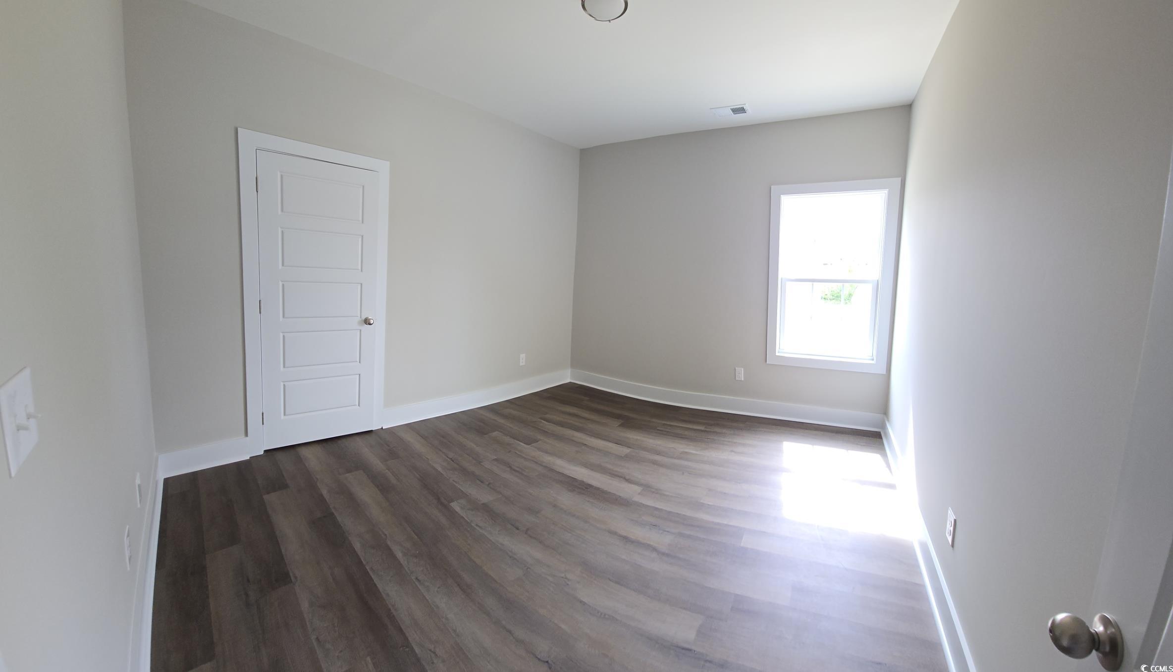 4890 Highway 319 Aynor, SC 29511 - Photo 9 of 21 Unfurnished room featuring baseboards and dark wood-style flooring