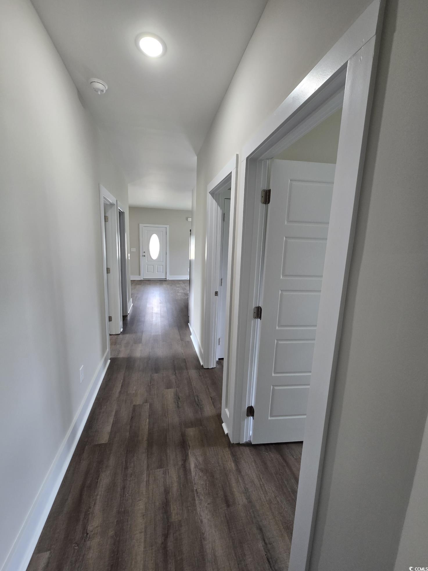 4890 Highway 319 Aynor, SC 29511 - Photo 10 of 21 Corridor featuring dark wood finished floors and baseboards