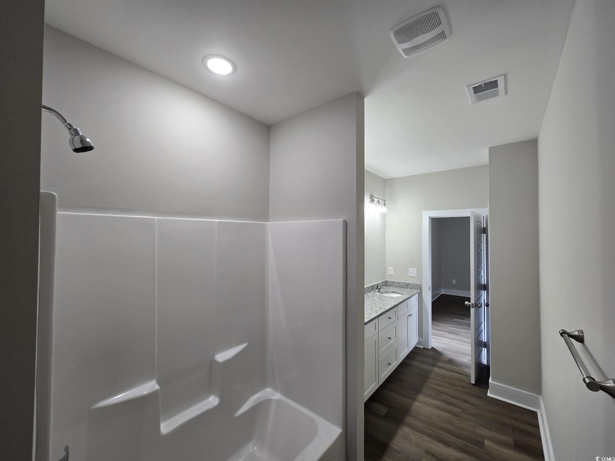4890 Highway 319 Aynor, SC 29511 - Photo 17 of 21 Full bathroom with vanity and dark wood-type flooring