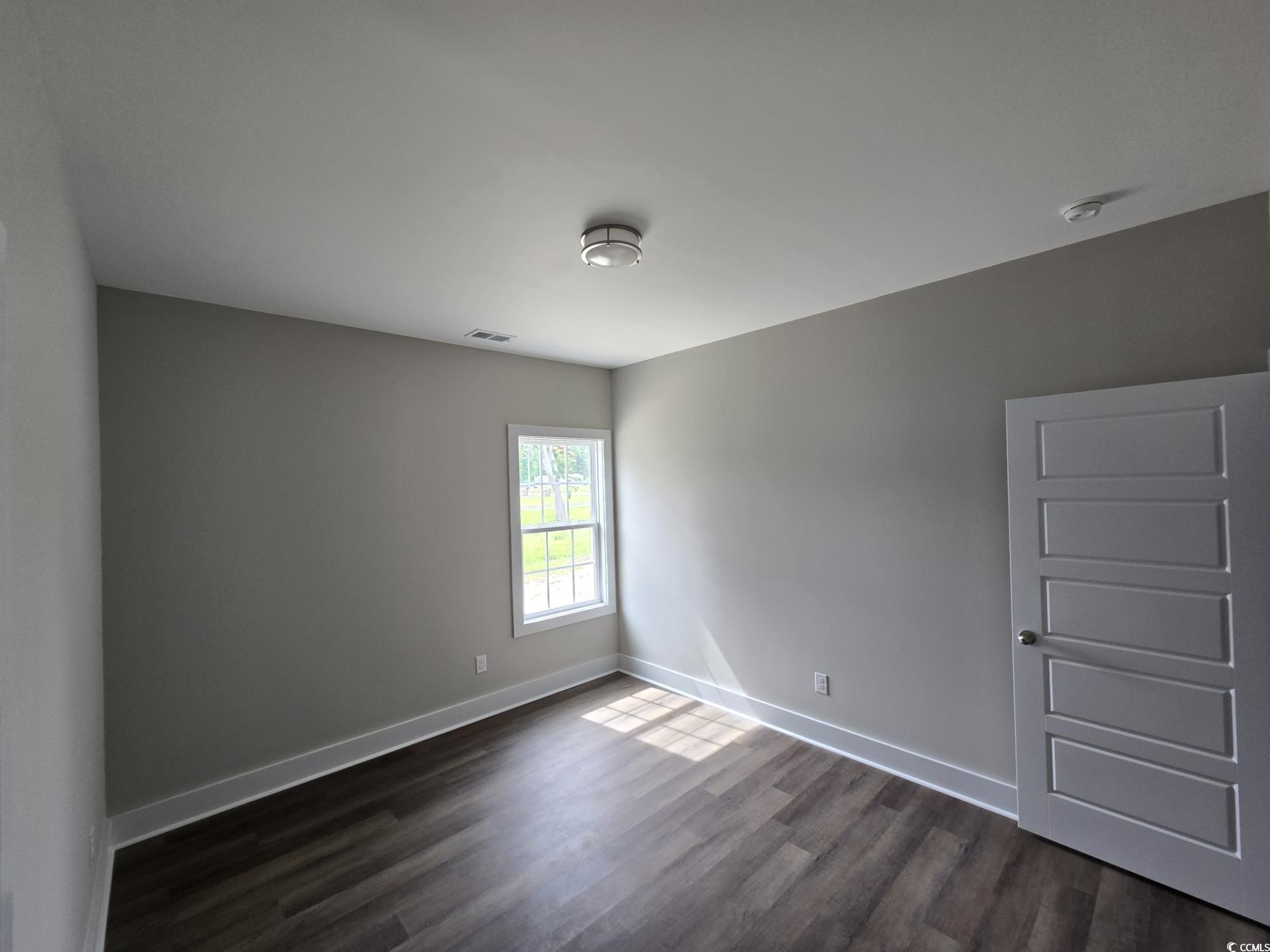 4890 Highway 319 Aynor, SC 29511 - Photo 3 of 21 Empty room with baseboards and dark wood-style flooring