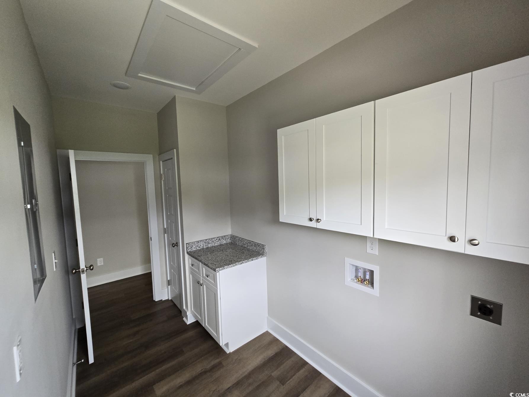 4890 Highway 319 Aynor, SC 29511 - Photo 4 of 21 Laundry area with cabinet space, washer hookup, dark wood-type flooring, and electric dryer hookup