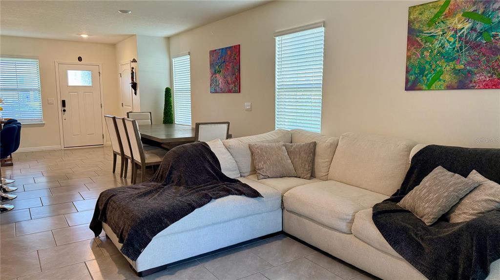 13340 Pontoon Road Winter Garden, FL 34787 - Photo 3 of 15 a living room with furniture and a window