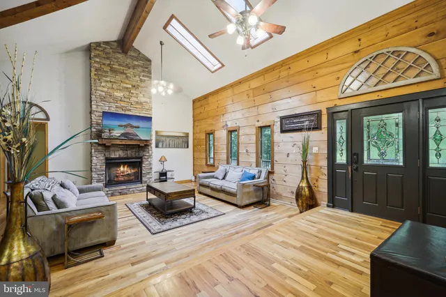 a bedroom with furniture and a fireplace