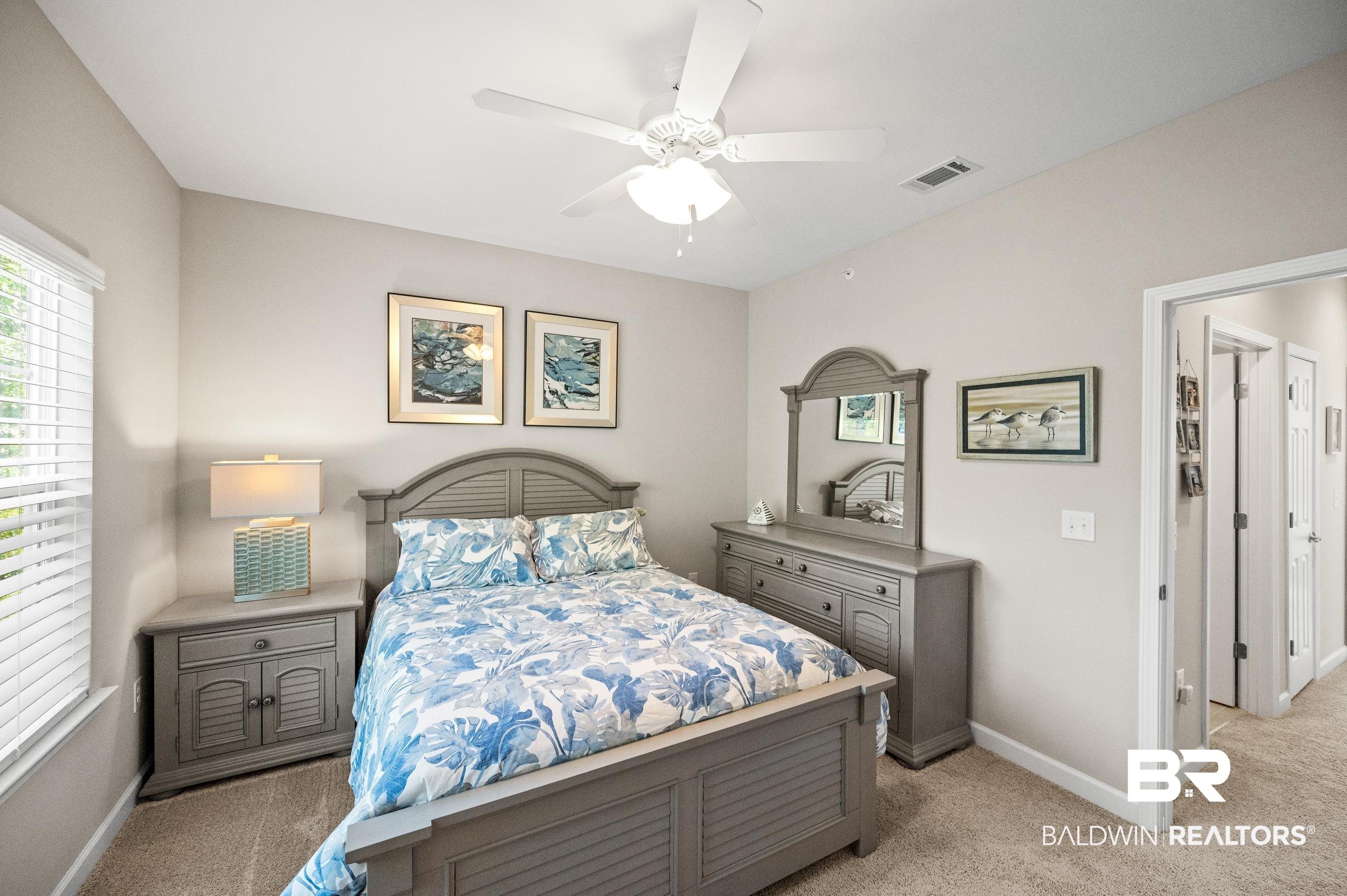 430 West Fort Morgan Road, Unit 1902 Gulf Shores, AL 36542 - Photo 29 of 59 Carpeted bedroom with ceiling fan