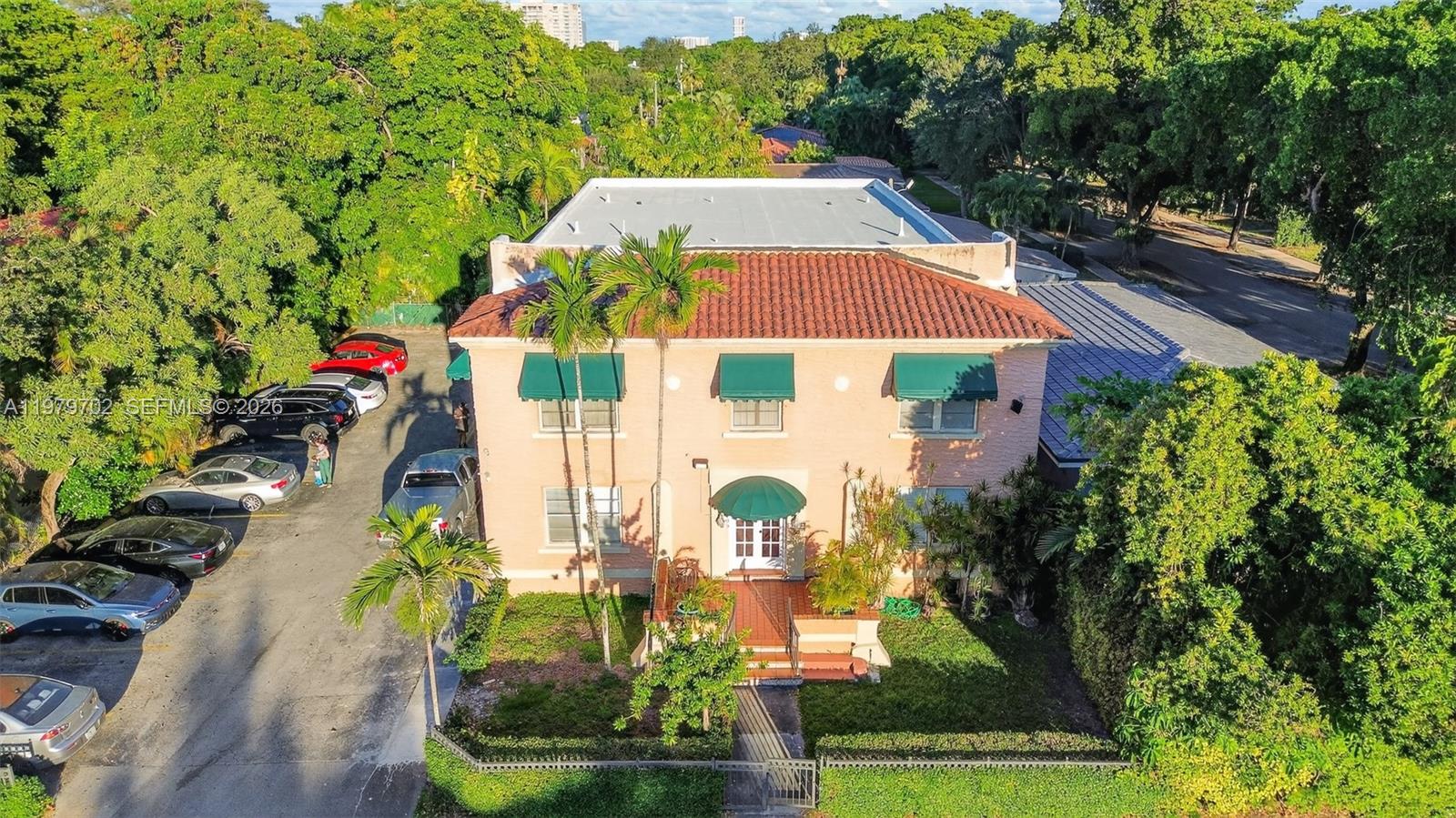 3409 South Le Jeune Road Coral Gables, FL 33134 - Photo 1 of 53 an aerial view of a house with swimming pool and garden