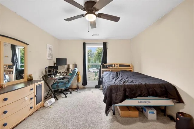 a view of backyard with swimming pool and outdoor seating