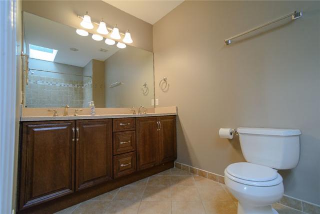 453 Rochelle Drive Nashville, TN 37220 - Photo 13 of 20 a bathroom with a granite countertop toilet sink and mirror