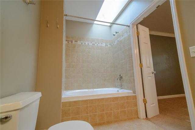 453 Rochelle Drive Nashville, TN 37220 - Photo 14 of 20 a bathroom with a tub and a shower