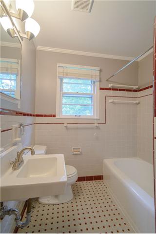 453 Rochelle Drive Nashville, TN 37220 - Photo 18 of 20 a bathroom with a sink a toilet a window and shower