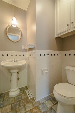 453 Rochelle Drive Nashville, TN 37220 - Photo 20 of 20 a bathroom with a sink a mirror and a toilet