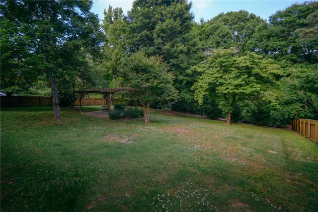 453 Rochelle Drive Nashville, TN 37220 - Photo 2 of 20 a backyard of a house with lots of green space and trampoline