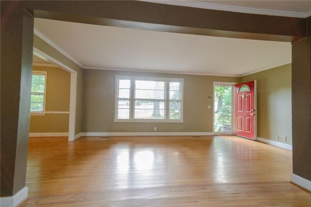 453 Rochelle Drive Nashville, TN 37220 - Photo 7 of 20 a view of an empty room with wooden floor and a window