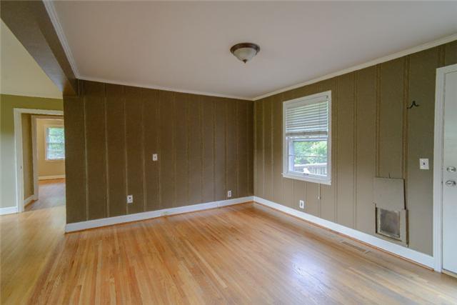 453 Rochelle Drive Nashville, TN 37220 - Photo 8 of 20 an empty room with wooden floor and windows