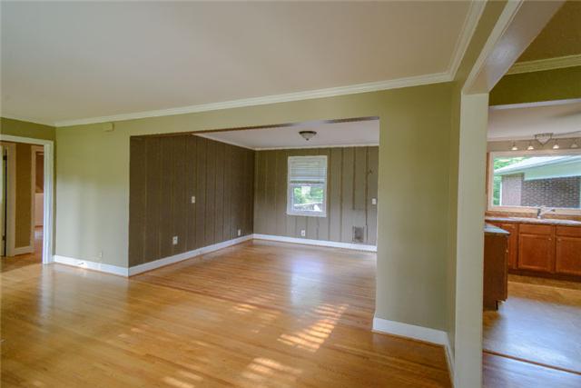 453 Rochelle Drive Nashville, TN 37220 - Photo 9 of 20 a view of a hallway with wooden floor and a living room