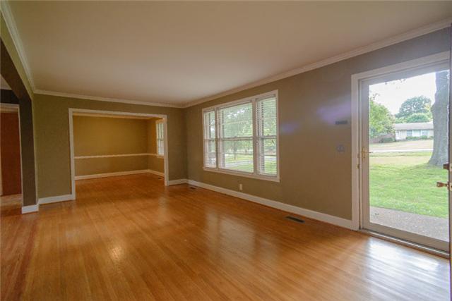 453 Rochelle Drive Nashville, TN 37220 - Photo 10 of 20 a view of an empty room with wooden floor and a window
