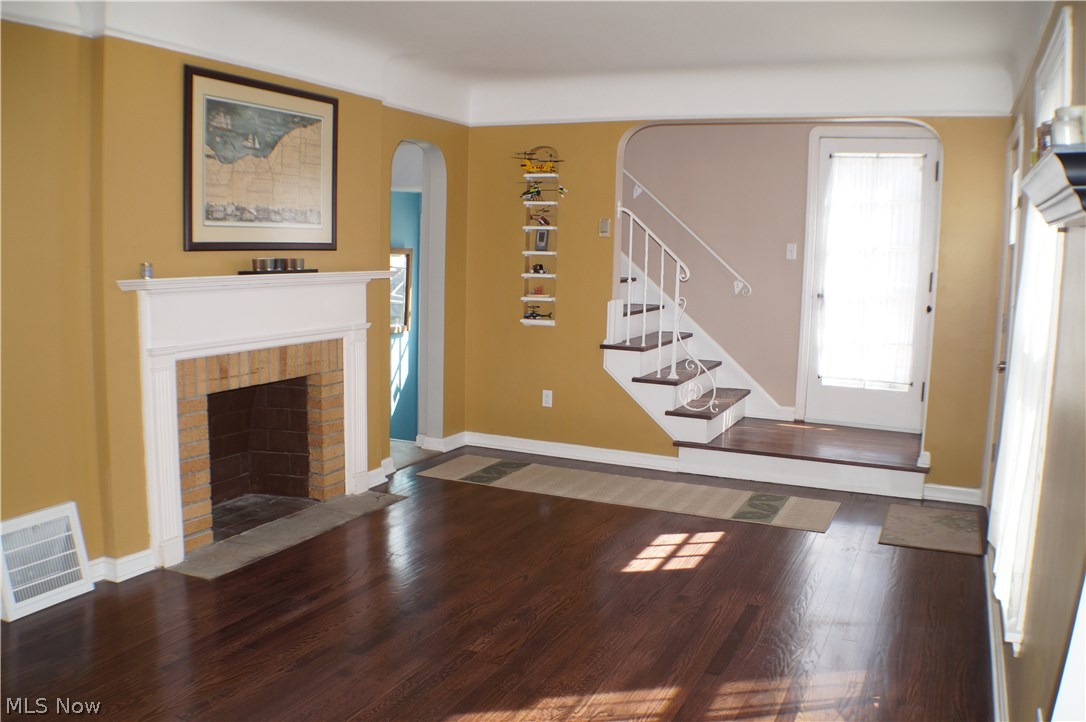 4681 Anderson Road Cleveland, OH 44121 - Photo 3 of 18 Sun-filled living room with newly refinished hardwood floors, new windows, new entry door and fireplace.