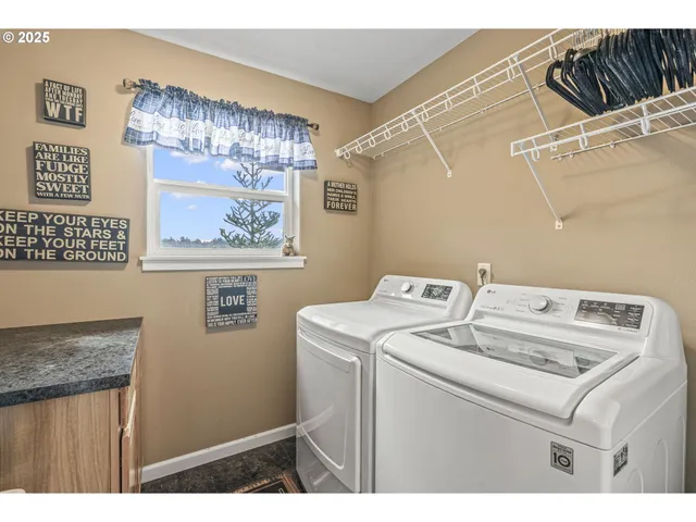 a bathroom with a granite countertop sink a toilet and a mirror