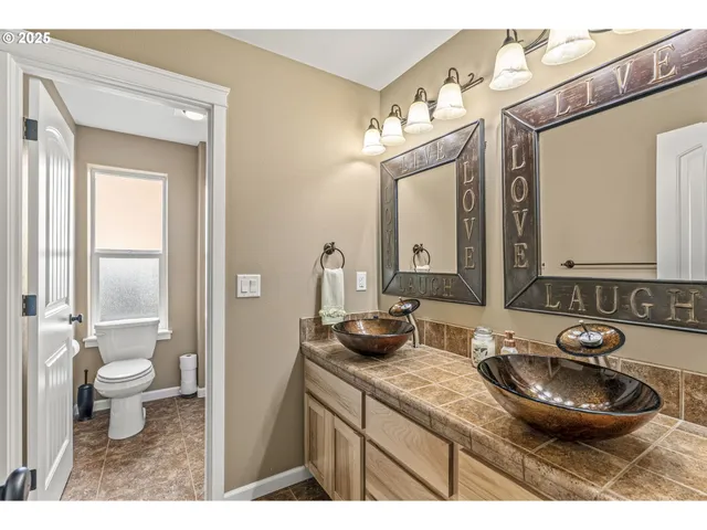 a bedroom with a bed and a table