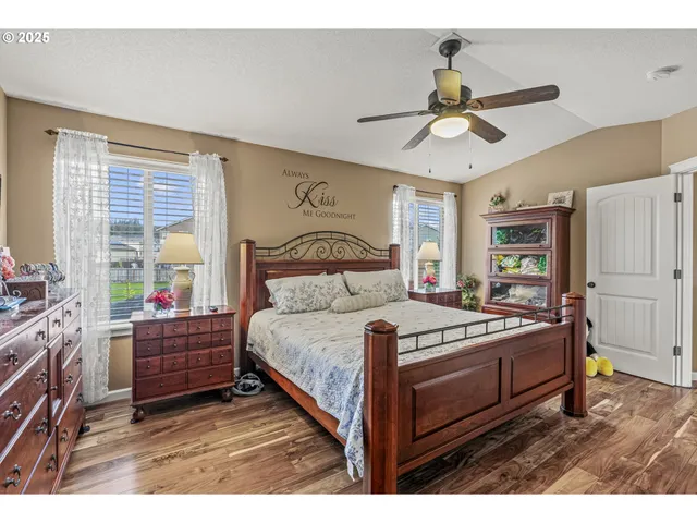 a bathroom with a sink a large mirror and a shower