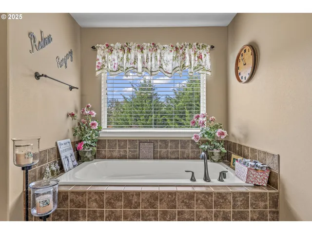 a bathroom with a shower sink and mirror