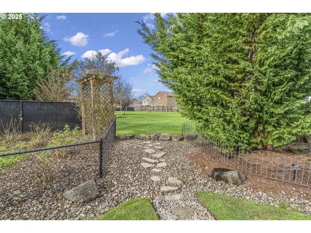 a view of a big yard with a house