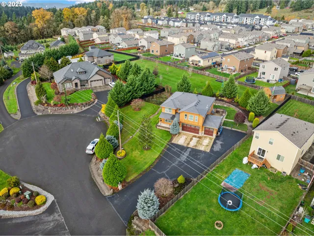 an aerial view of a house with yard swimming pool and outdoor seating