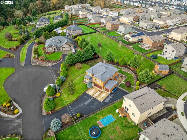 an aerial view of a house with a garden