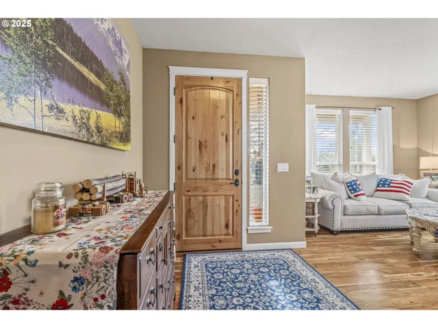 a living room with furniture and a table