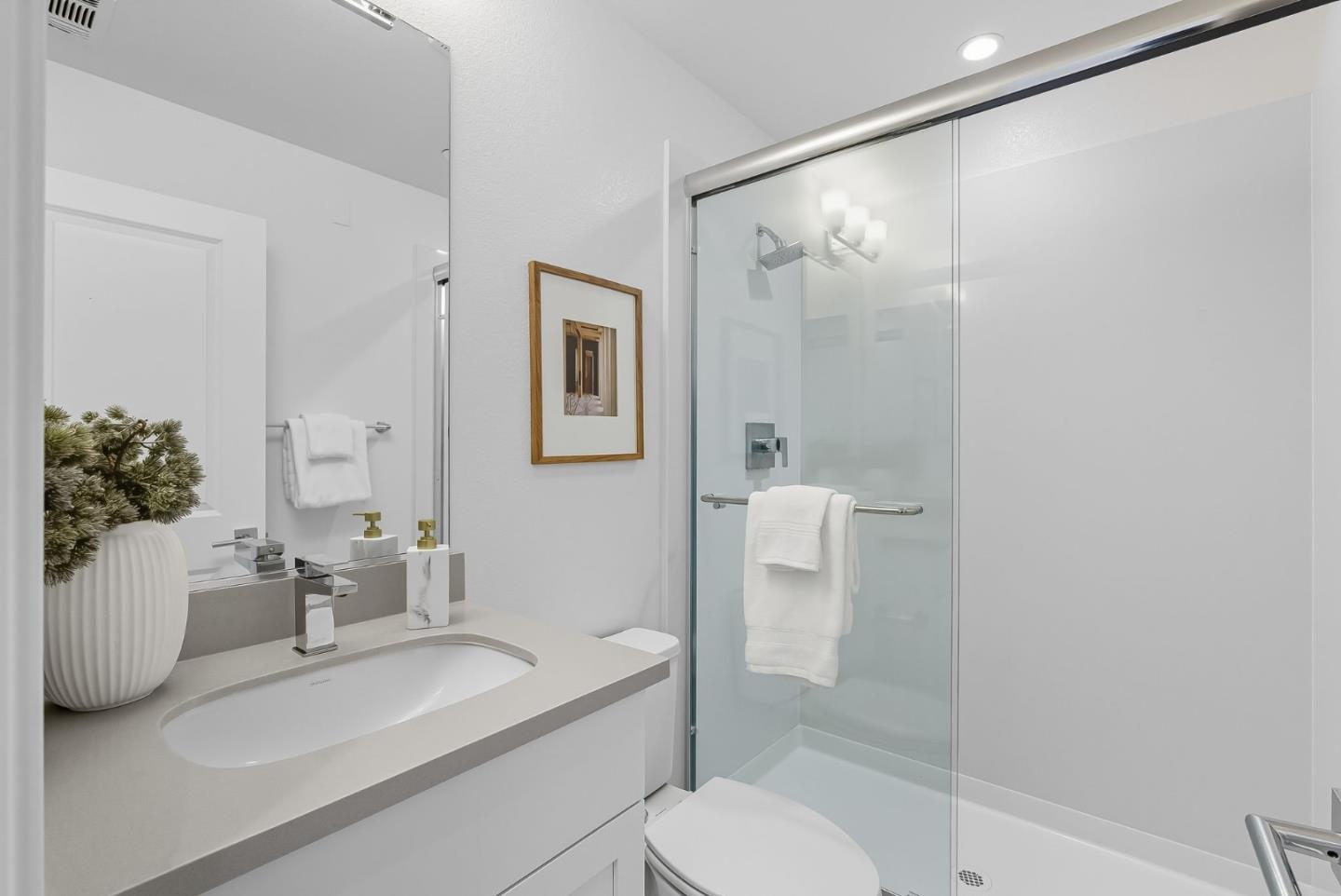 1387 West Middlefield Road Mountain View, CA 94043 - Photo 14 of 28 a bathroom with a sink a toilet and shower