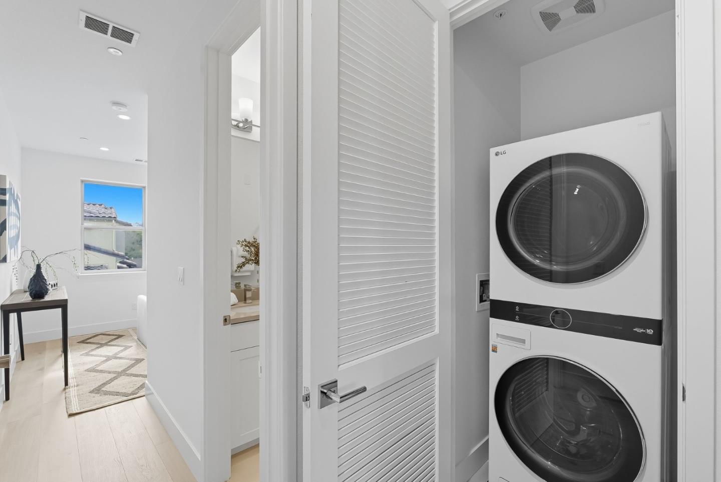 1387 West Middlefield Road Mountain View, CA 94043 - Photo 20 of 28 a view of a hallway with washer and dryer