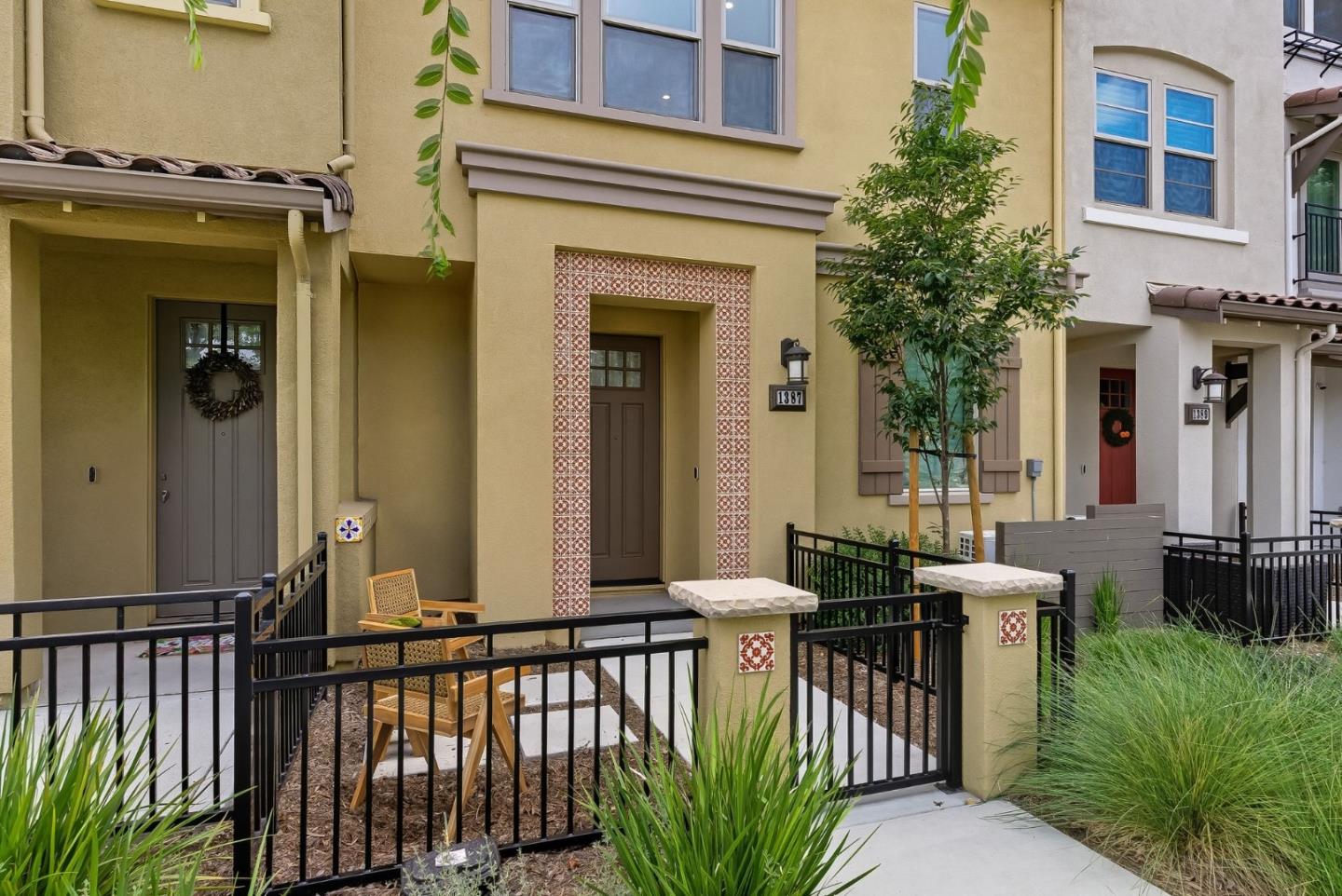 1387 West Middlefield Road Mountain View, CA 94043 - Photo 2 of 28 a view of a house with a small yard and plants