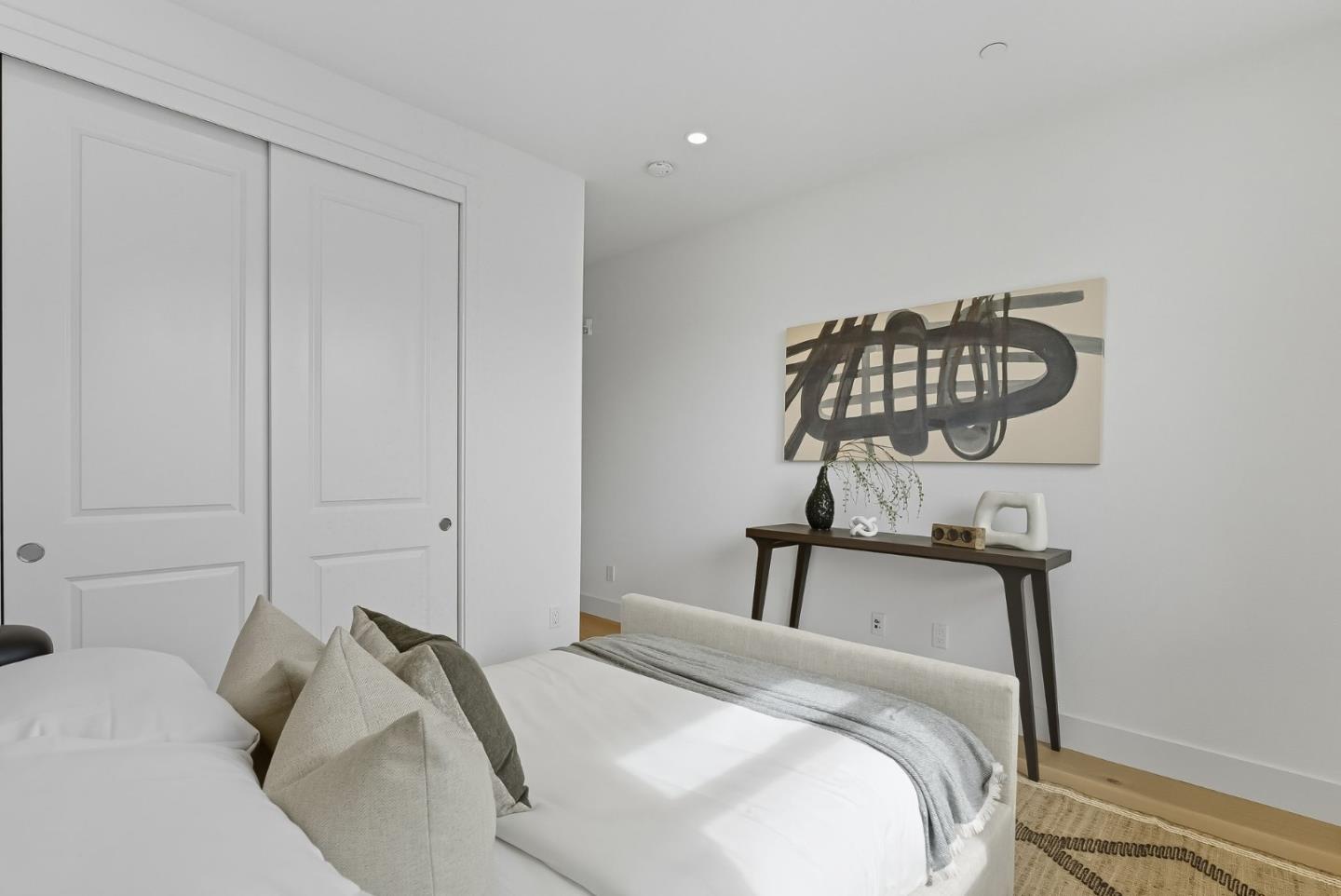 1387 West Middlefield Road Mountain View, CA 94043 - Photo 23 of 28 a bedroom with a bed and chandelier