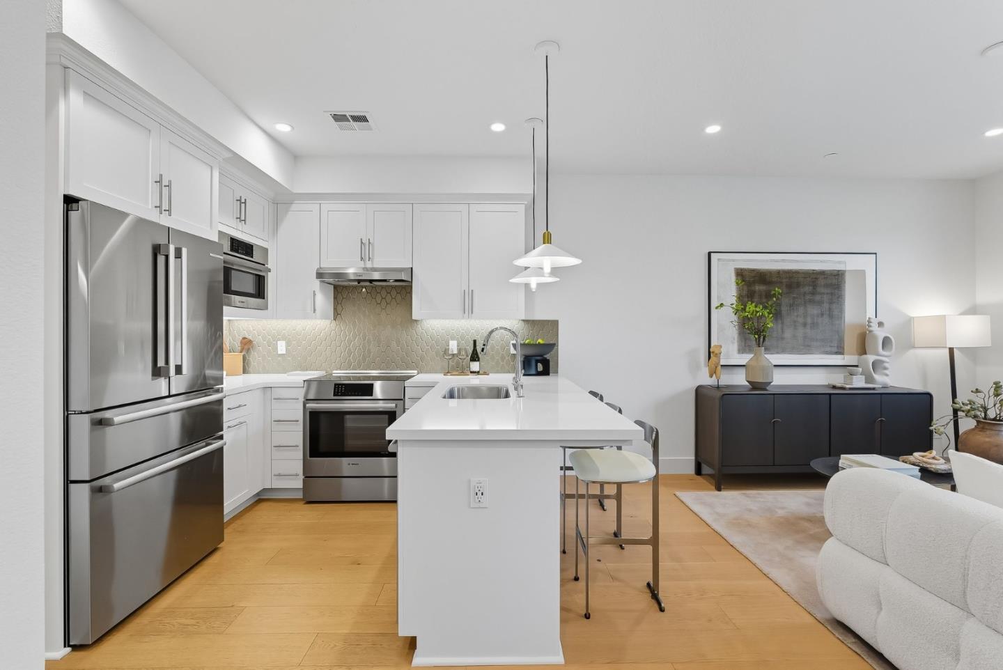 1387 West Middlefield Road Mountain View, CA 94043 - Photo 6 of 28 a kitchen with a refrigerator a stove a sink dishwasher a oven with a dining table and chairs
