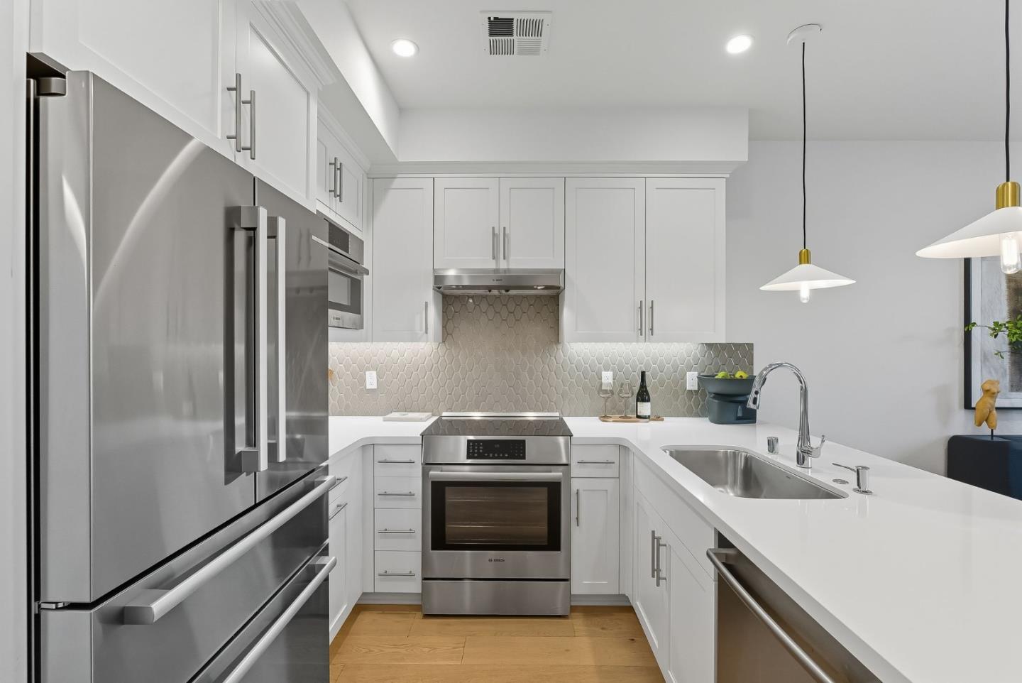 1387 West Middlefield Road Mountain View, CA 94043 - Photo 8 of 28 a kitchen with a sink cabinets and stainless steel appliances
