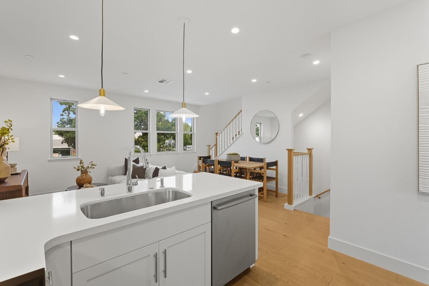 1387 West Middlefield Road Mountain View, CA 94043 - Photo 10 of 28 a kitchen with center island a sink stainless steel appliances and a chandelier