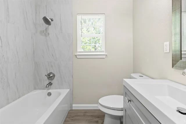 a bathroom with a sink toilet and bathtub