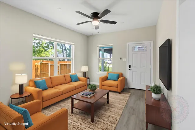 a living room with furniture and a large window