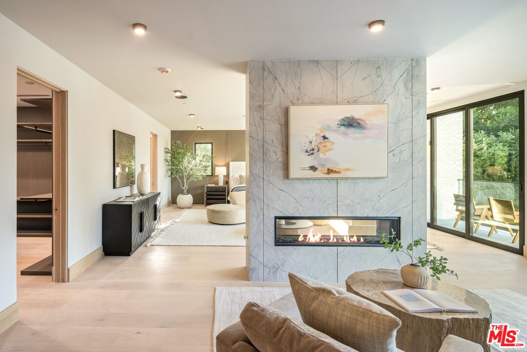 17055 Rancho Street Encino, CA 91316 - Photo 55 of 73 a living room with furniture and a large window