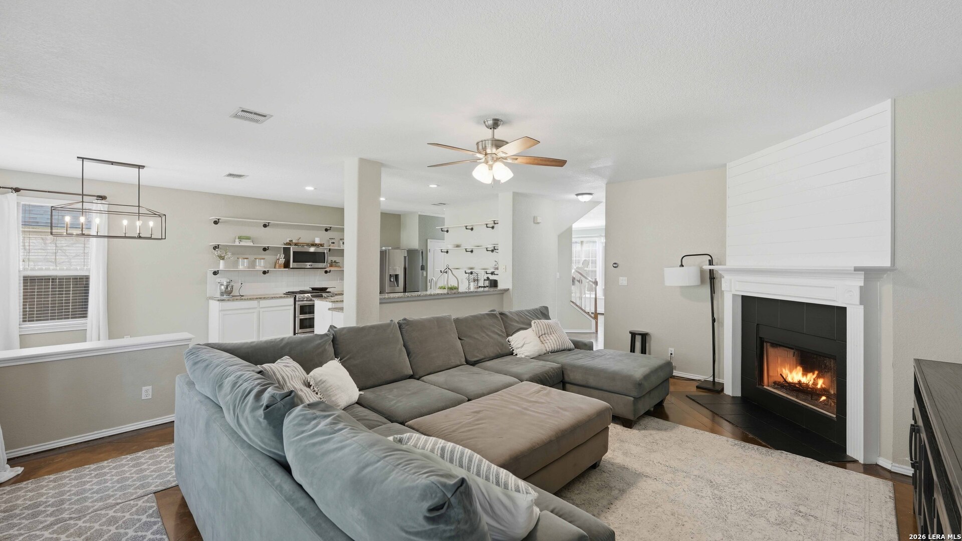 4520 Ridge Peak Drive Schertz, TX 78154 - Photo 11 of 44 a living room with furniture a fireplace and a window