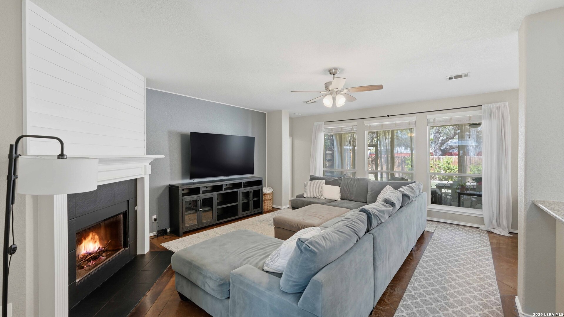 4520 Ridge Peak Drive Schertz, TX 78154 - Photo 12 of 44 a living room with furniture and a flat screen tv