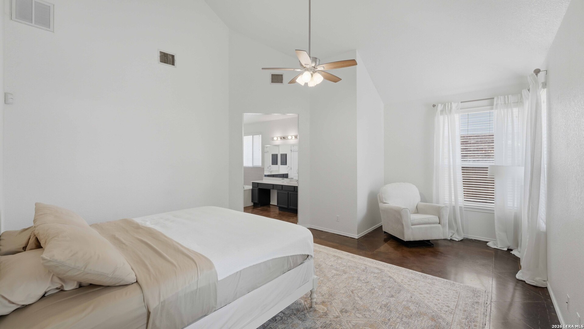 4520 Ridge Peak Drive Schertz, TX 78154 - Photo 14 of 44 a bedroom with a bed and a chandelier