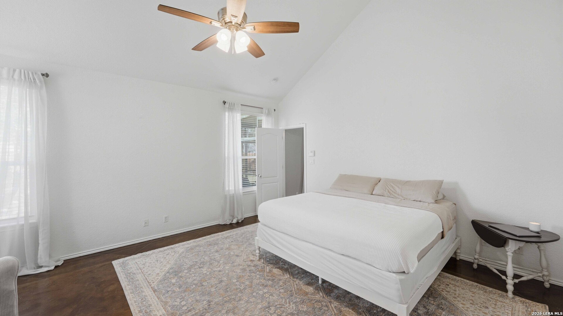 4520 Ridge Peak Drive Schertz, TX 78154 - Photo 15 of 44 a bedroom with a bed and a chandelier