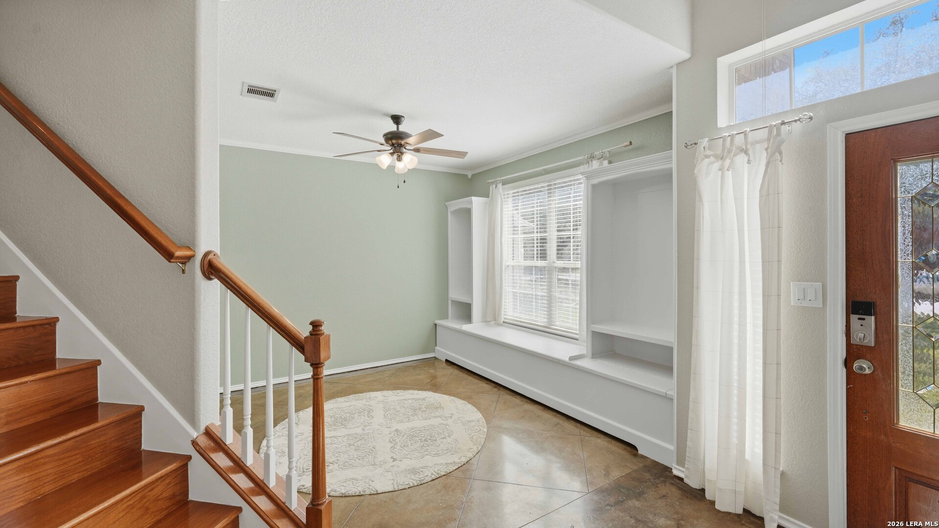 4520 Ridge Peak Drive Schertz, TX 78154 - Photo 19 of 44 a view of an entryway with wooden floor and stairs
