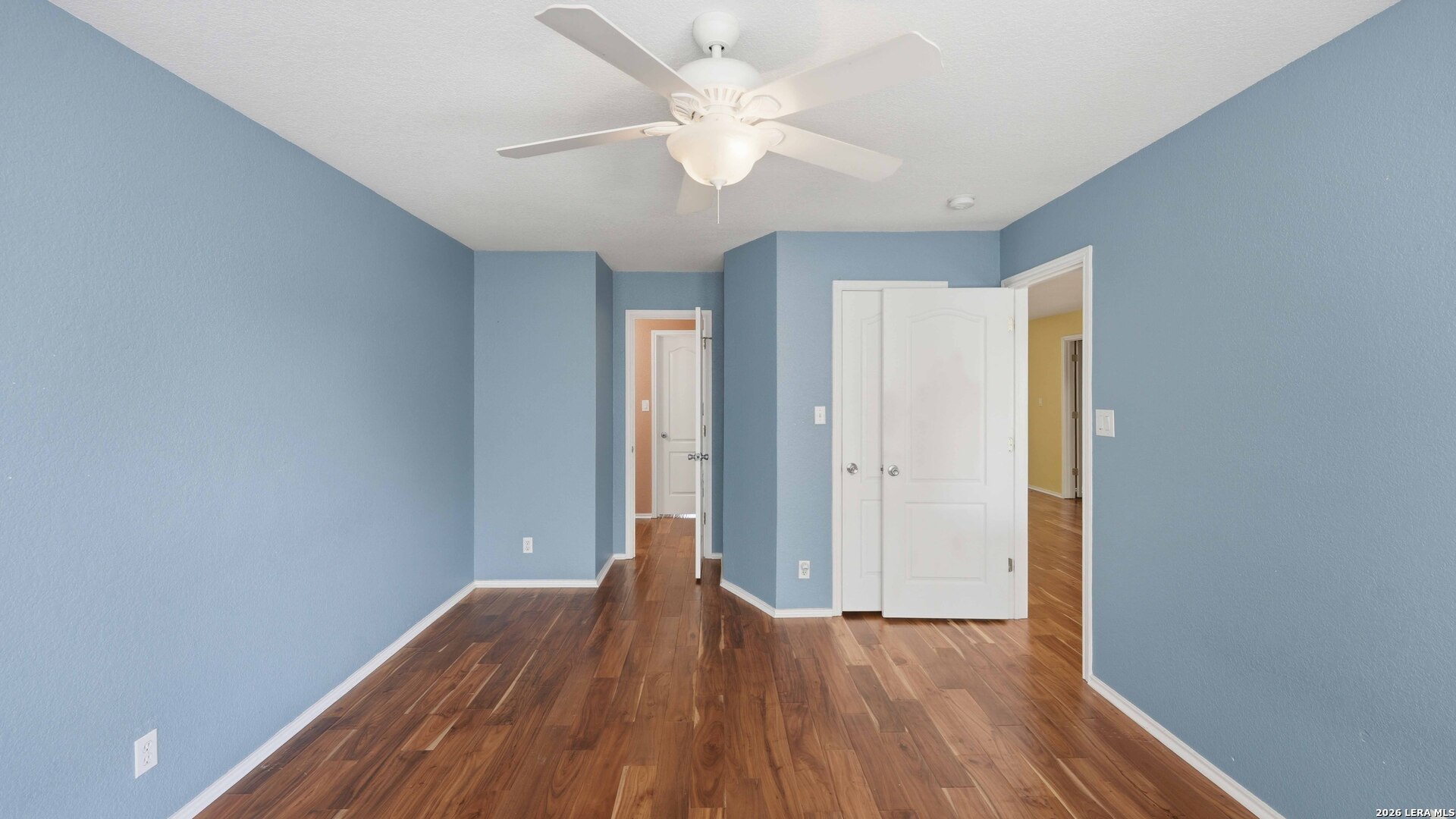 4520 Ridge Peak Drive Schertz, TX 78154 - Photo 27 of 44 wooden floor in an empty room with a window