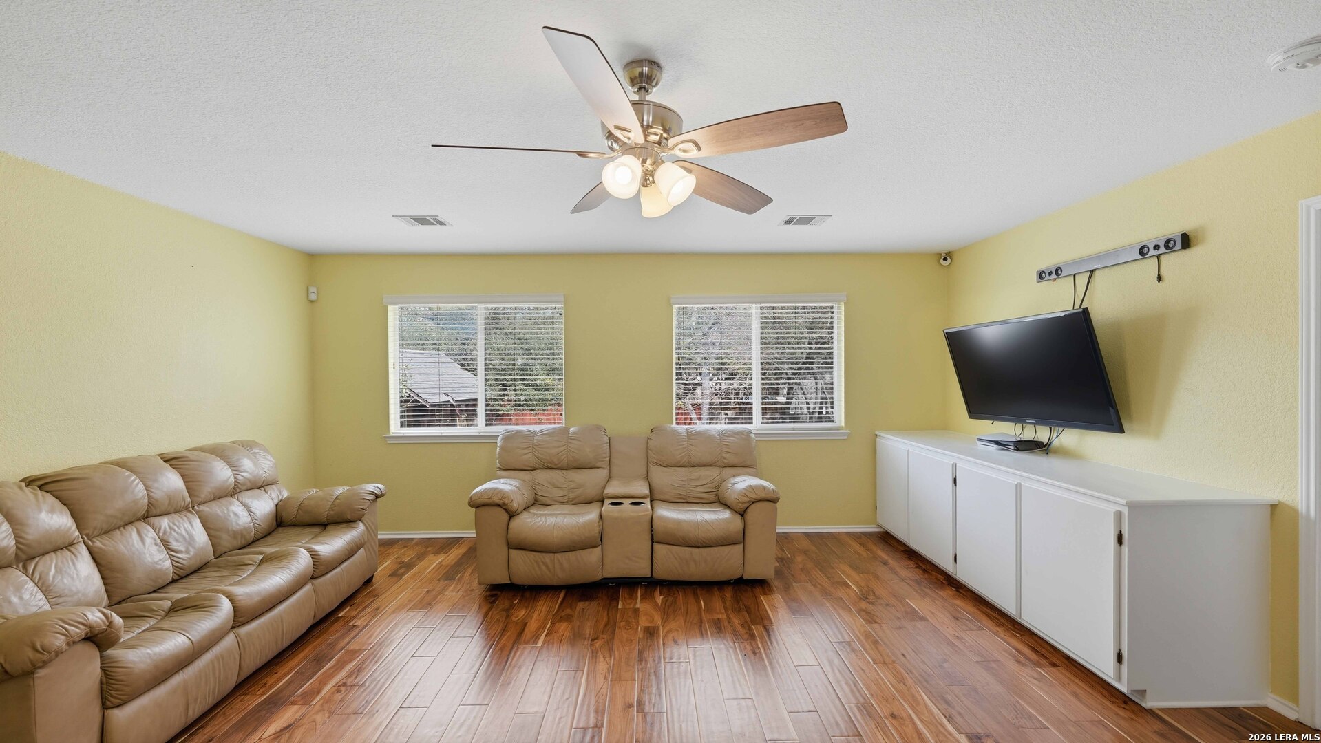 4520 Ridge Peak Drive Schertz, TX 78154 - Photo 29 of 44 a living room with furniture and a flat screen tv