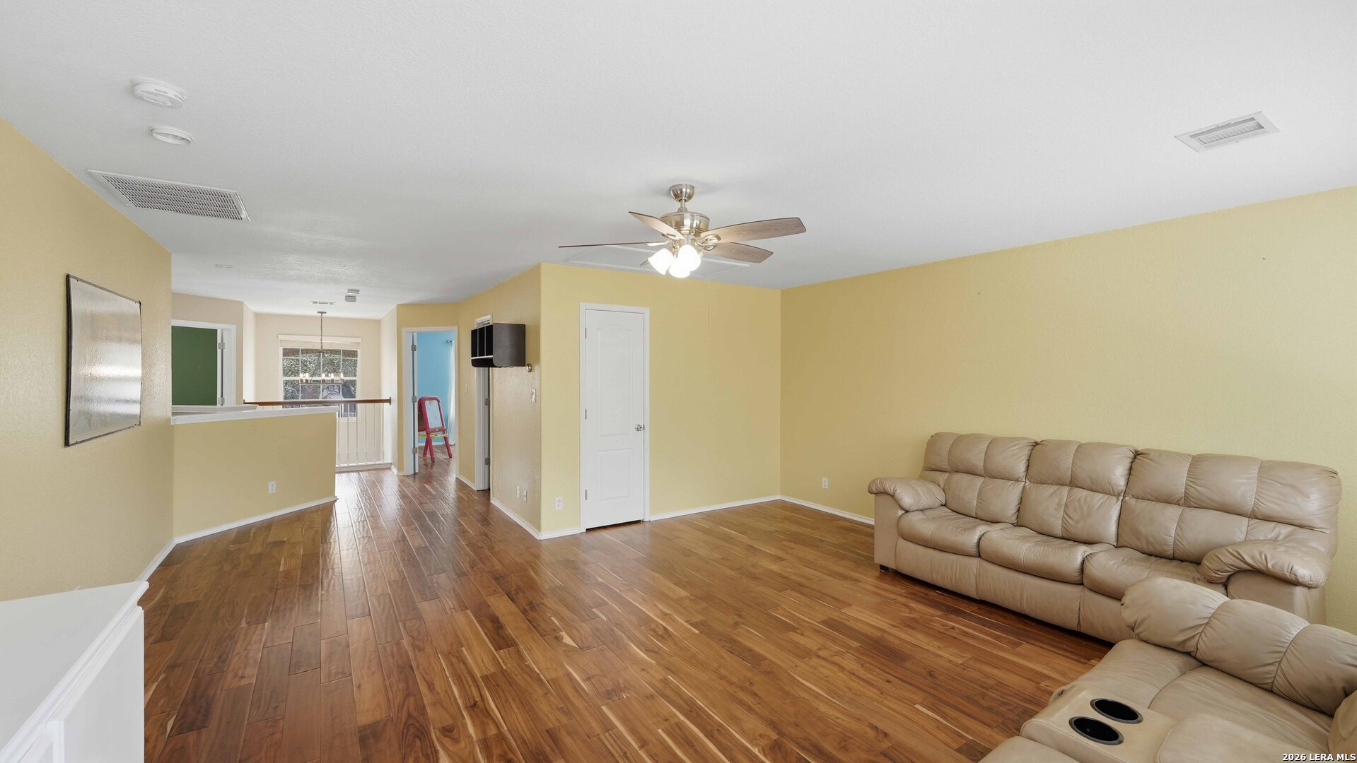 4520 Ridge Peak Drive Schertz, TX 78154 - Photo 30 of 44 a living room with furniture and a wooden floor