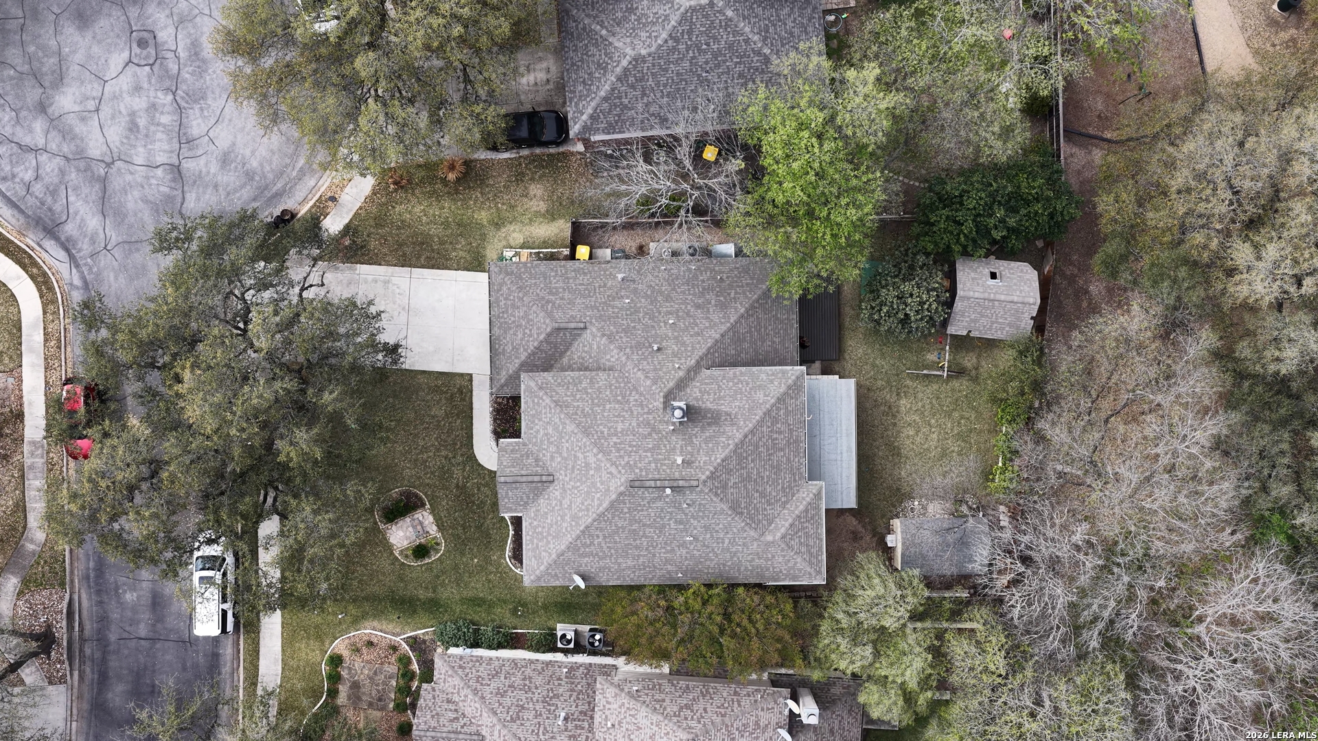 4520 Ridge Peak Drive Schertz, TX 78154 - Photo 43 of 44 an aerial view of a house with a yard and large tree