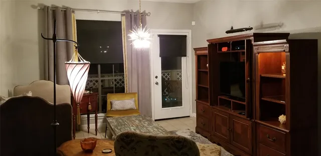 a bedroom with a bed and cabinets